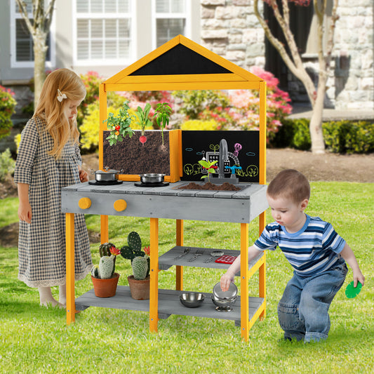 Children playing with the outdoor kitchen playset in a garden setting