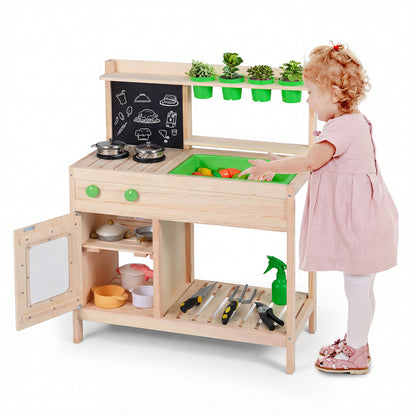 A toddler opening the cabinet door of the wooden play kitchen set