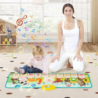 The musical floor mat being used by a young child and an adult in a bright living room