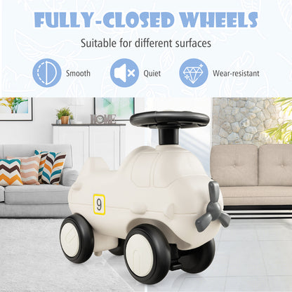 The push and pedal ride on toy placed in a modern living room with a sofa and soft furnishings