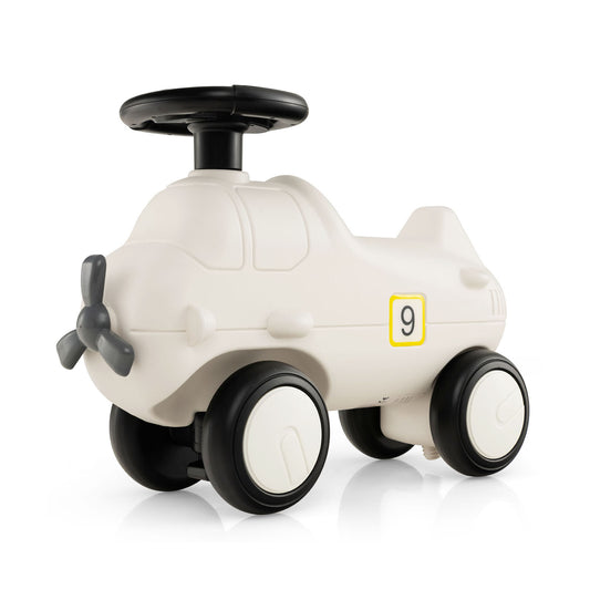 Kids Plane Ride On Toy Car in cream with a black propeller and steering wheel on a white background