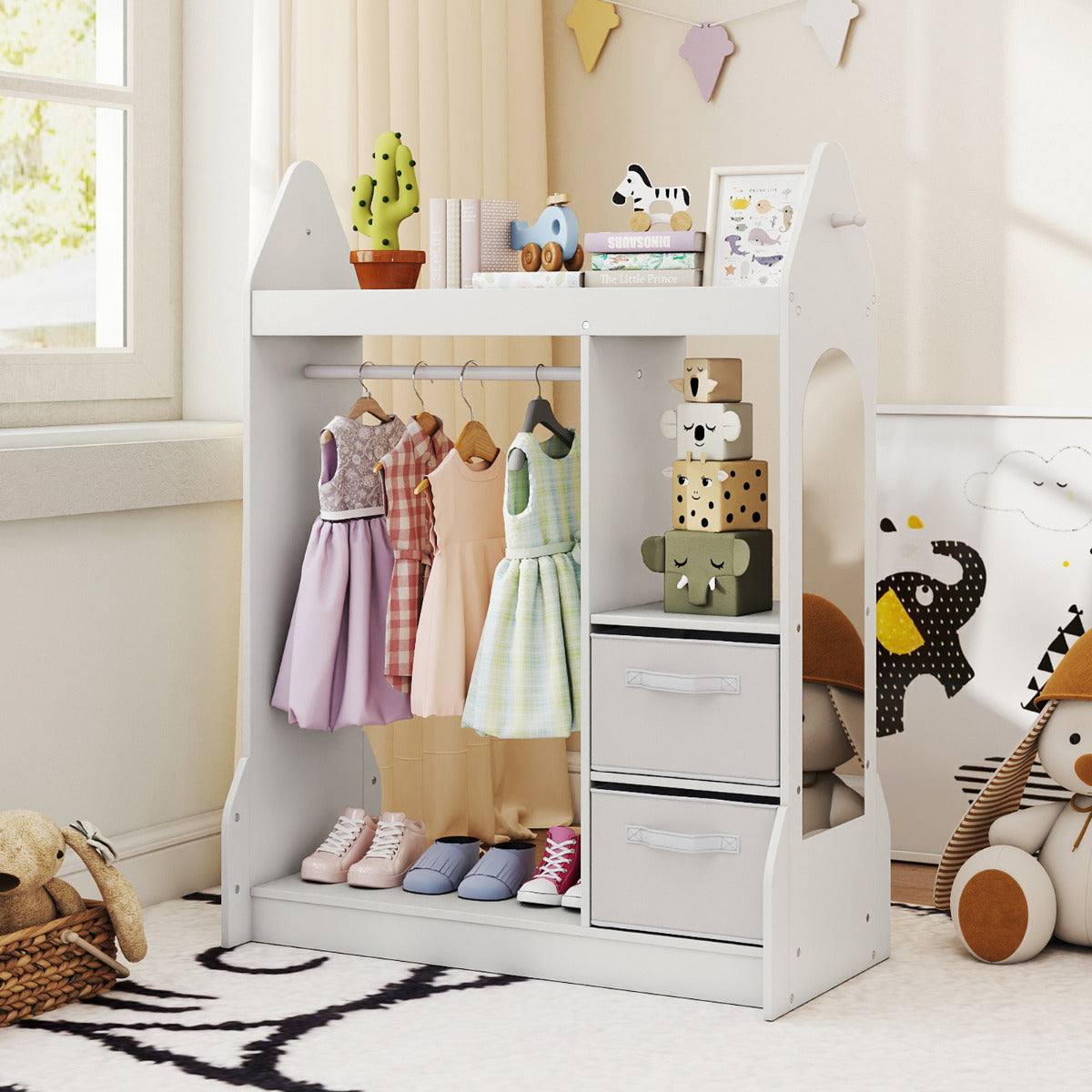 The white kids play armoire dresser with a hanging rail and two fabric drawers