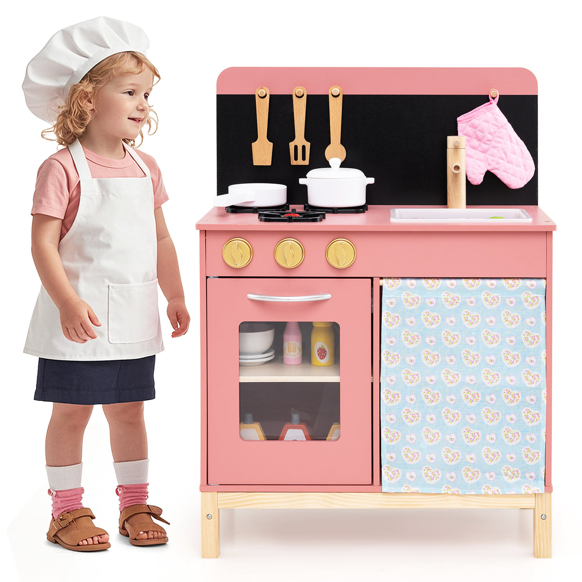 Kids Play Kitchen Set with a child wearing an apron and chef's hat standing next to it