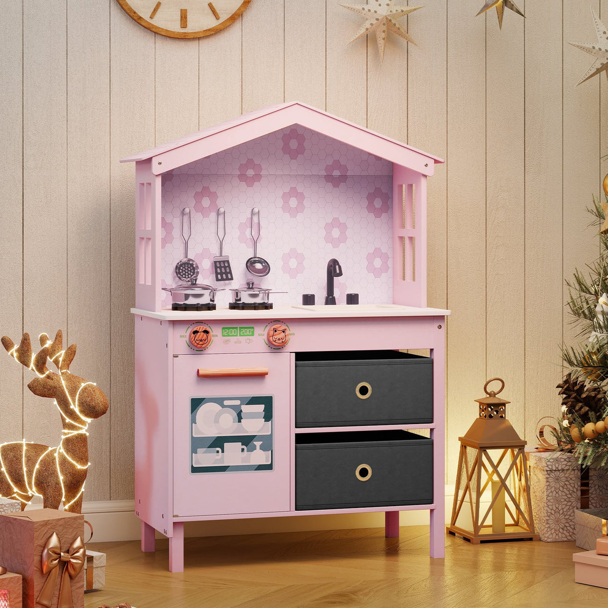 Pink play kitchen set with decorative reindeer and lantern in a festive room