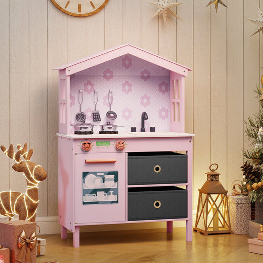 Pink play kitchen set with decorative reindeer and lantern in a festive room
