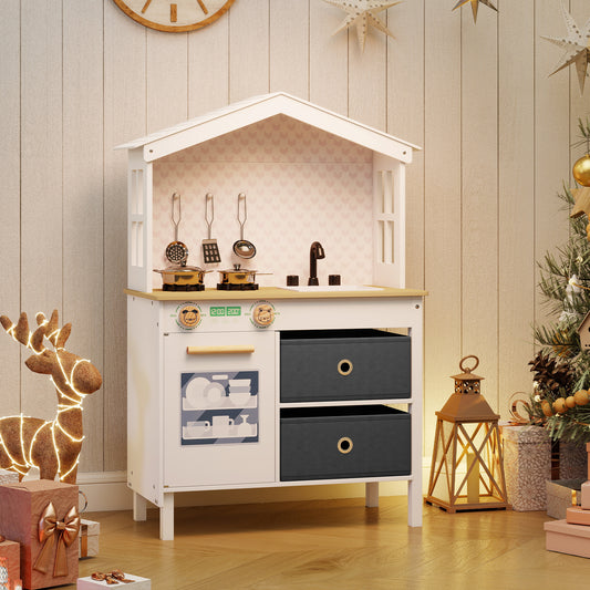 The play kitchen is set up in a room with Christmas decorations