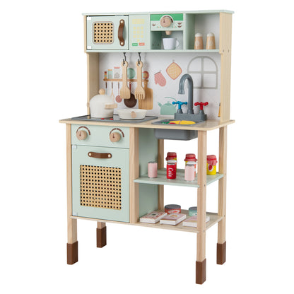 Close up of the green wooden play kitchen showing the rattan doors and accessories