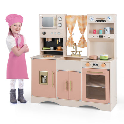 Kids Play Kitchen Wooden with microwave and ice maker in pink, with a child wearing a pink apron and hat