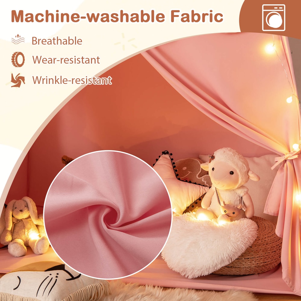 Close-up of the pink fabric of the play tent bed, showing texture