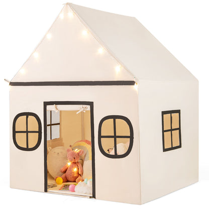The playhouse showing the side window and open entrance with soft toys inside
