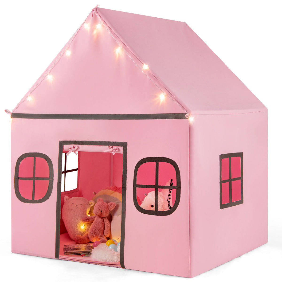 A large pink playhouse with fairy lights and windows, viewed from the front