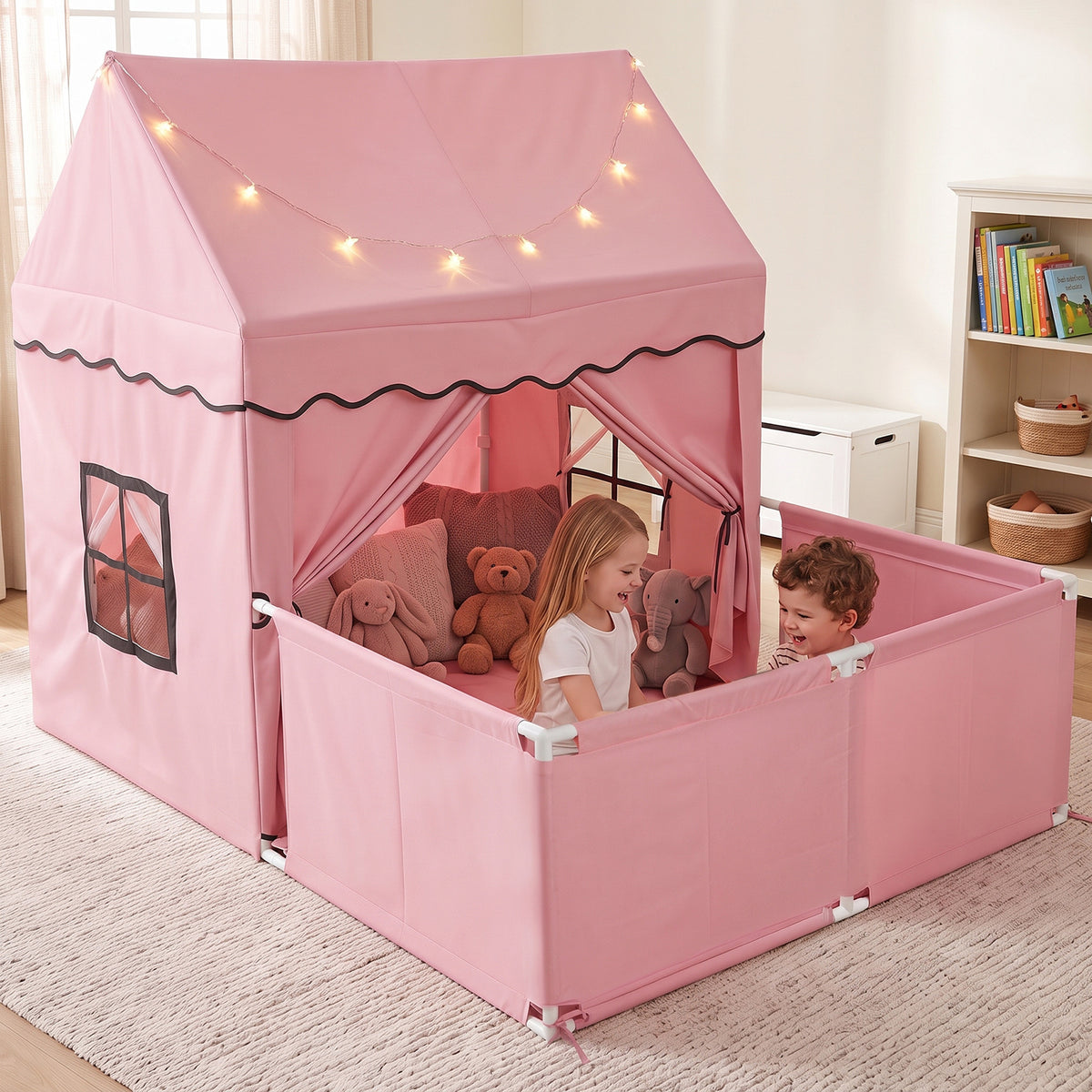 Two children playing happily inside the pink play tent with detachable playpen and star lights