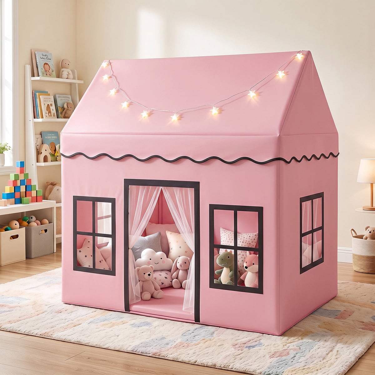 Pink play tent with star lights and windows, decorated with stuffed animals and cushions inside