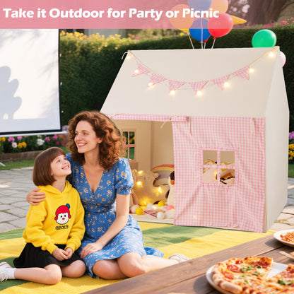 The pink play tent placed on a garden patio for an outdoor party