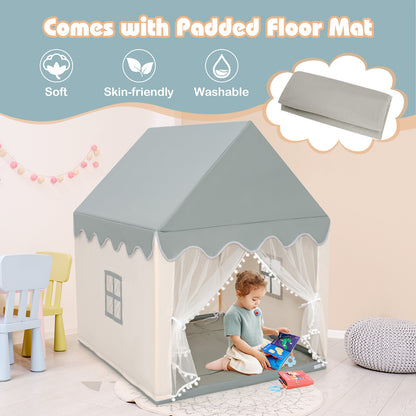 Child playing inside the beige and grey play tent which comes with a padded floor mat