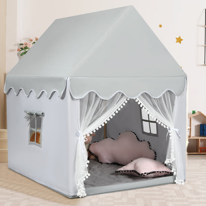 Grey fabric play tent with white scalloped trim and pom-poms, shown with sheer curtains