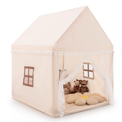 The beige play tent with two stuffed tigers and a large flower cushion on the floor