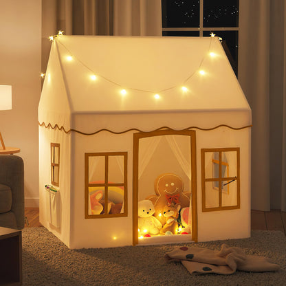 The play tent is lit up at night with soft interior lighting and fairy lights