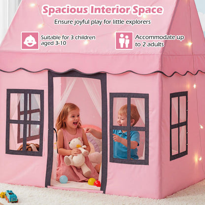 The play tent interior with two children playing inside with their soft toys
