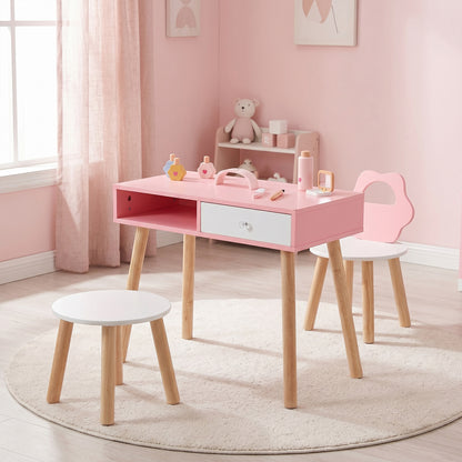 The kids table and chair set placed on a round rug in a bright pink bedroom setting