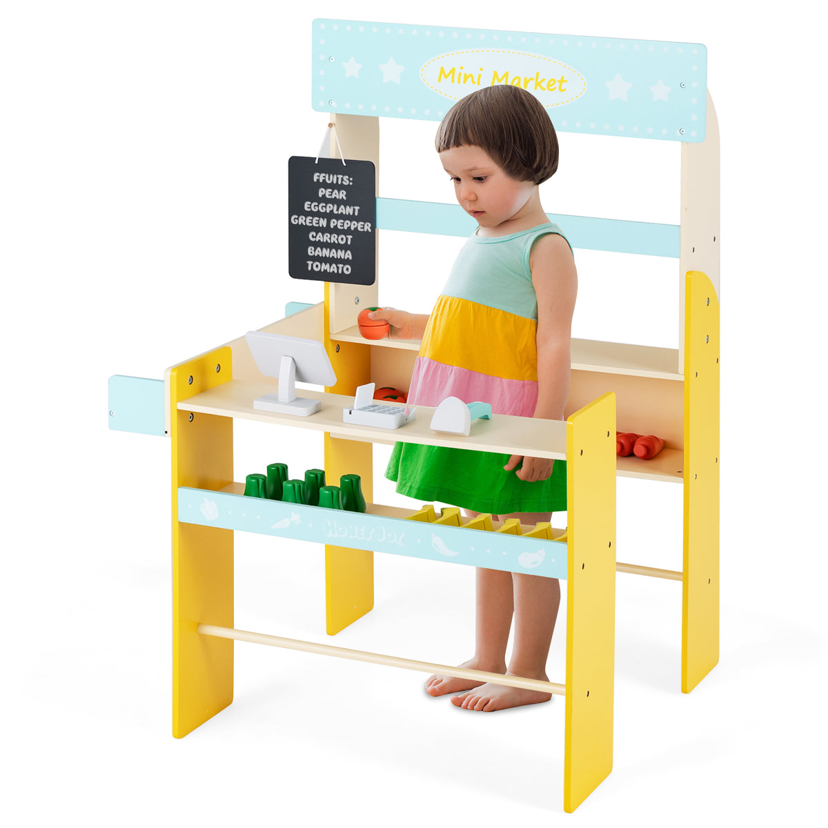 A young child interacting with the blue and yellow pretend play grocery store, pretending to be a shopkeeper