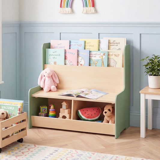 The kids storage unit placed against a blue panelled wall with toys and books on display