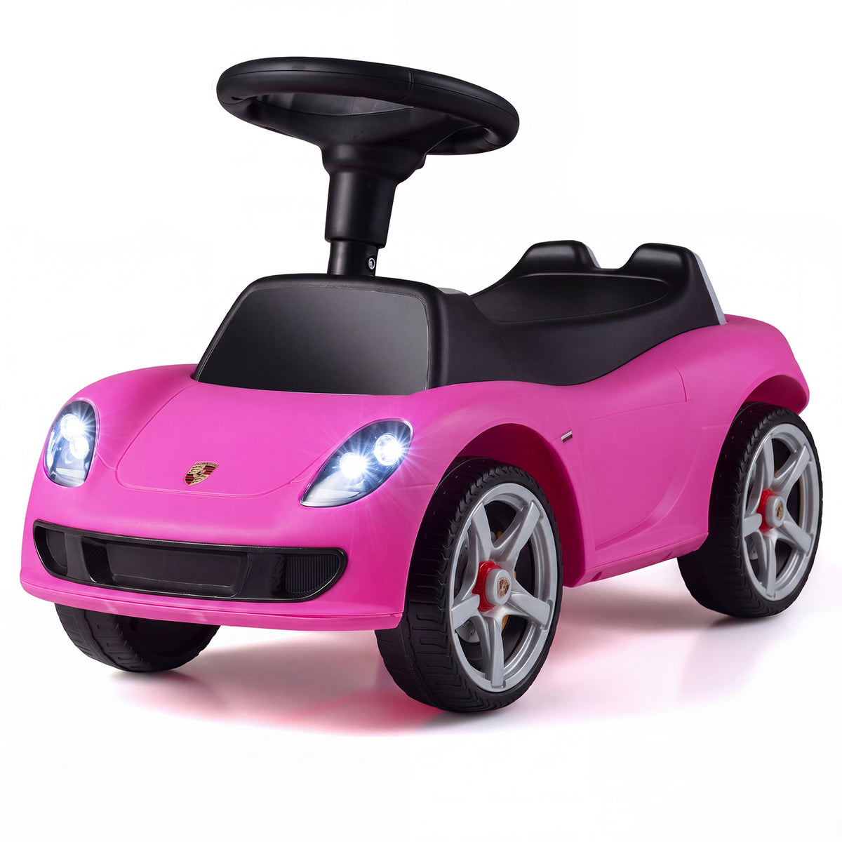 The pink sliding car viewed from a low angle showing the front wheels and headlights