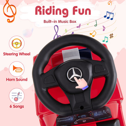 Close-up of the steering wheel and dashboard of the red fire truck toy with music notes