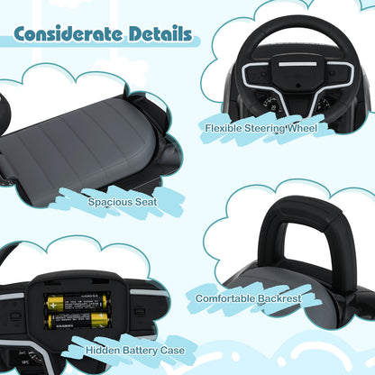 Close up of the black push and pedal ride on toy car's seat, steering wheel and battery case