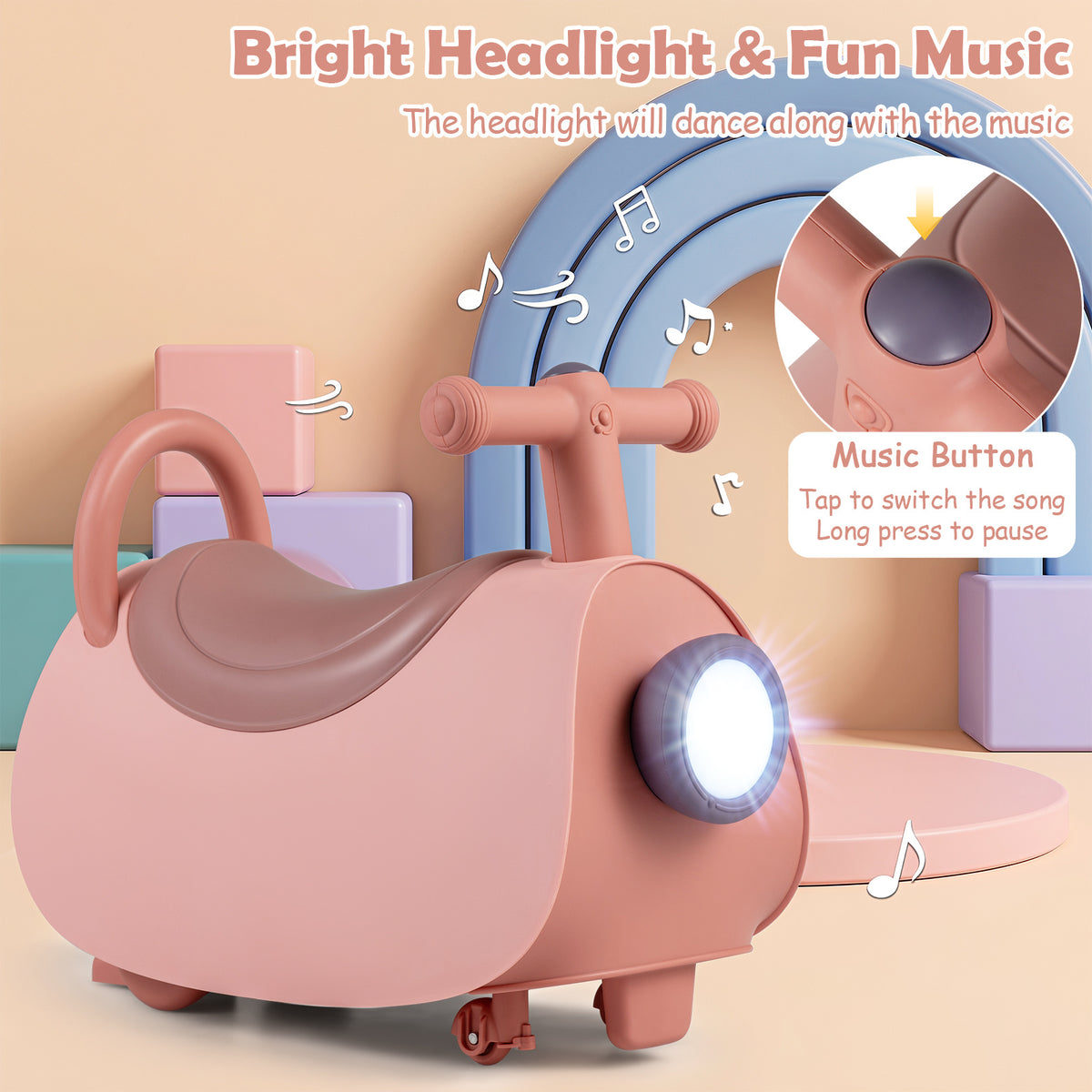 Close up of the pink push and pedal ride on toy showing headlight and music button