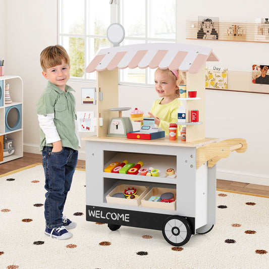 Children playing with the food cart toy set indoors