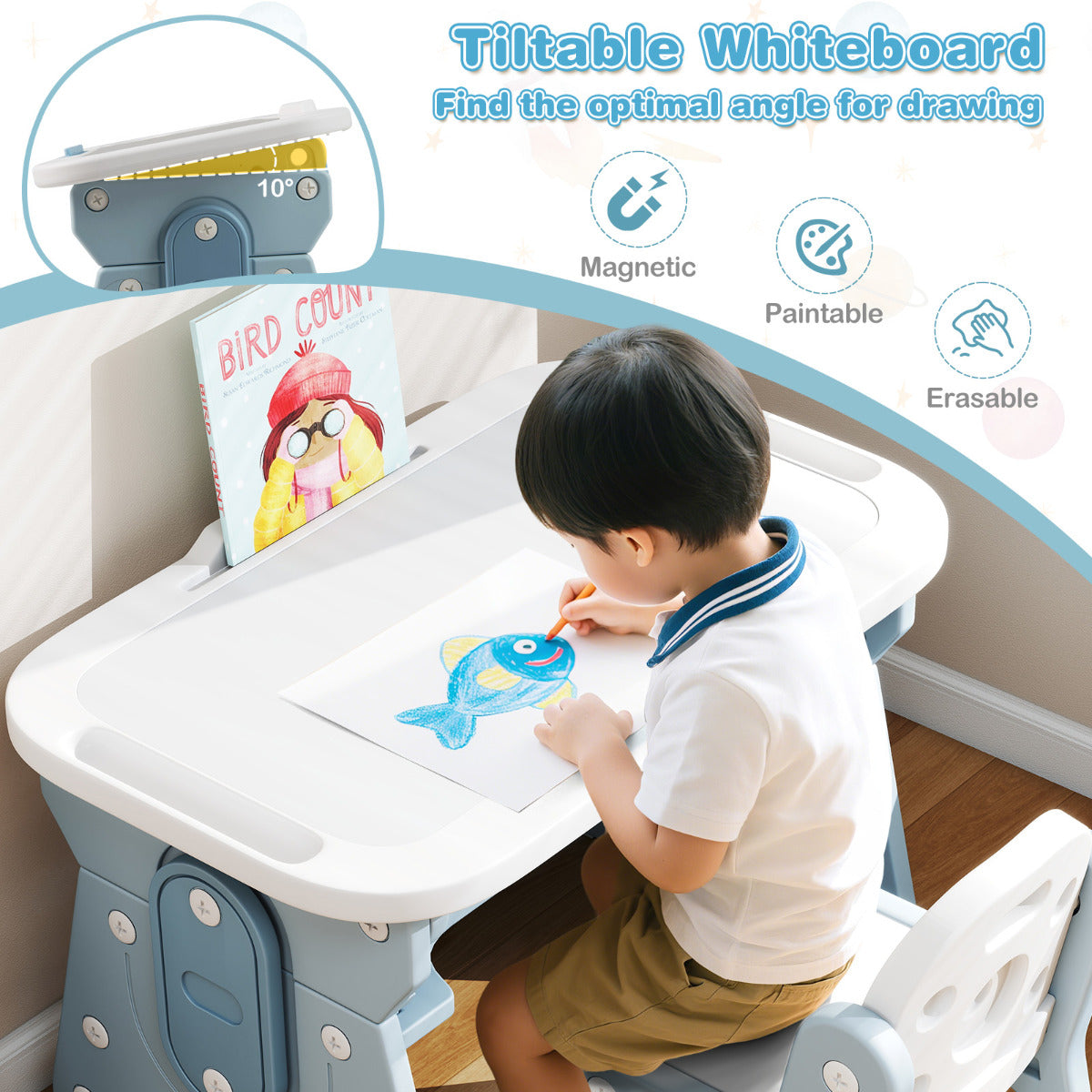 A young boy draws on the tiltable whiteboard of the blue kids table