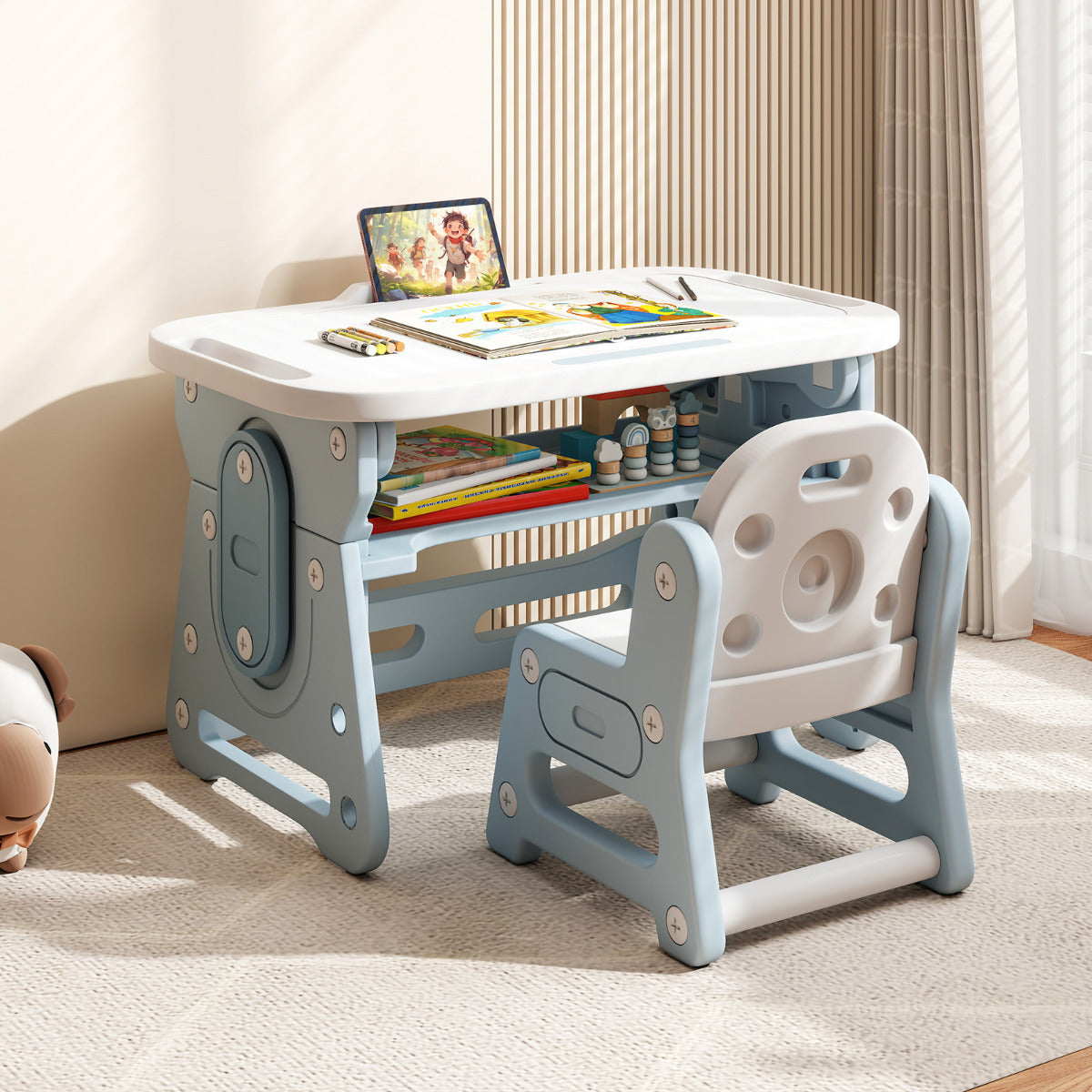 A blue kids table and chair set is displayed in a living room setting