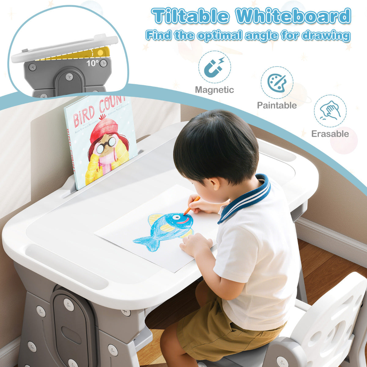 The kids table and chair set with the whiteboard tilted while a child draws on the surface