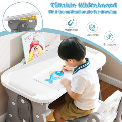 The kids table and chair set with the whiteboard tilted while a child draws on the surface