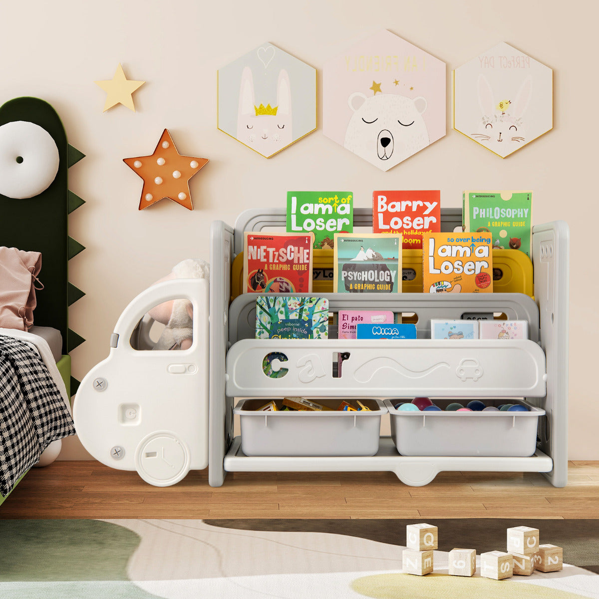 The car themed toy storage unit in a nursery with a bed and wall decorations