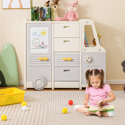 The toy storage unit in a child's bedroom, with a little girl reading on the floor next to it