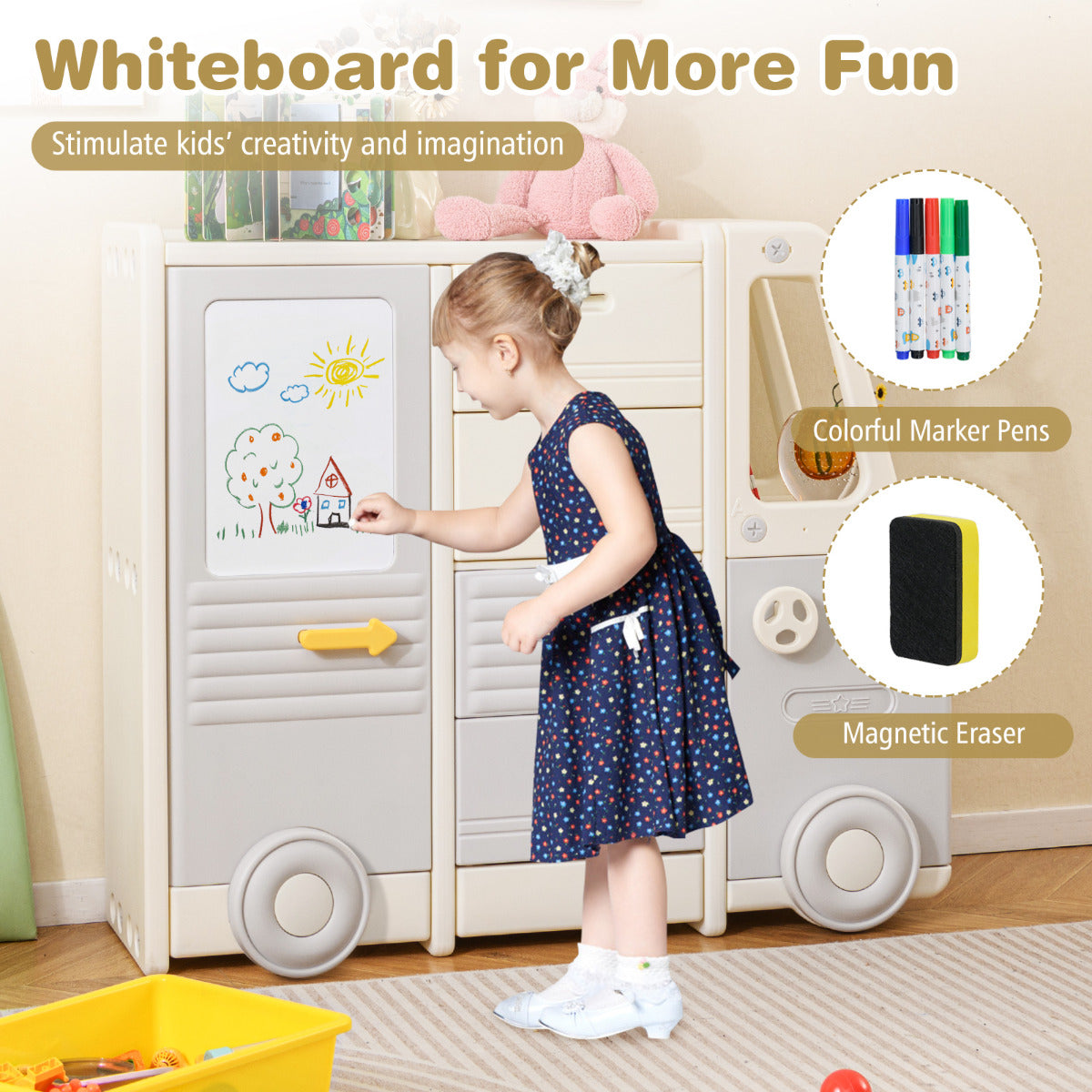 A child drawing on the whiteboard section of the toy storage unit with marker pens