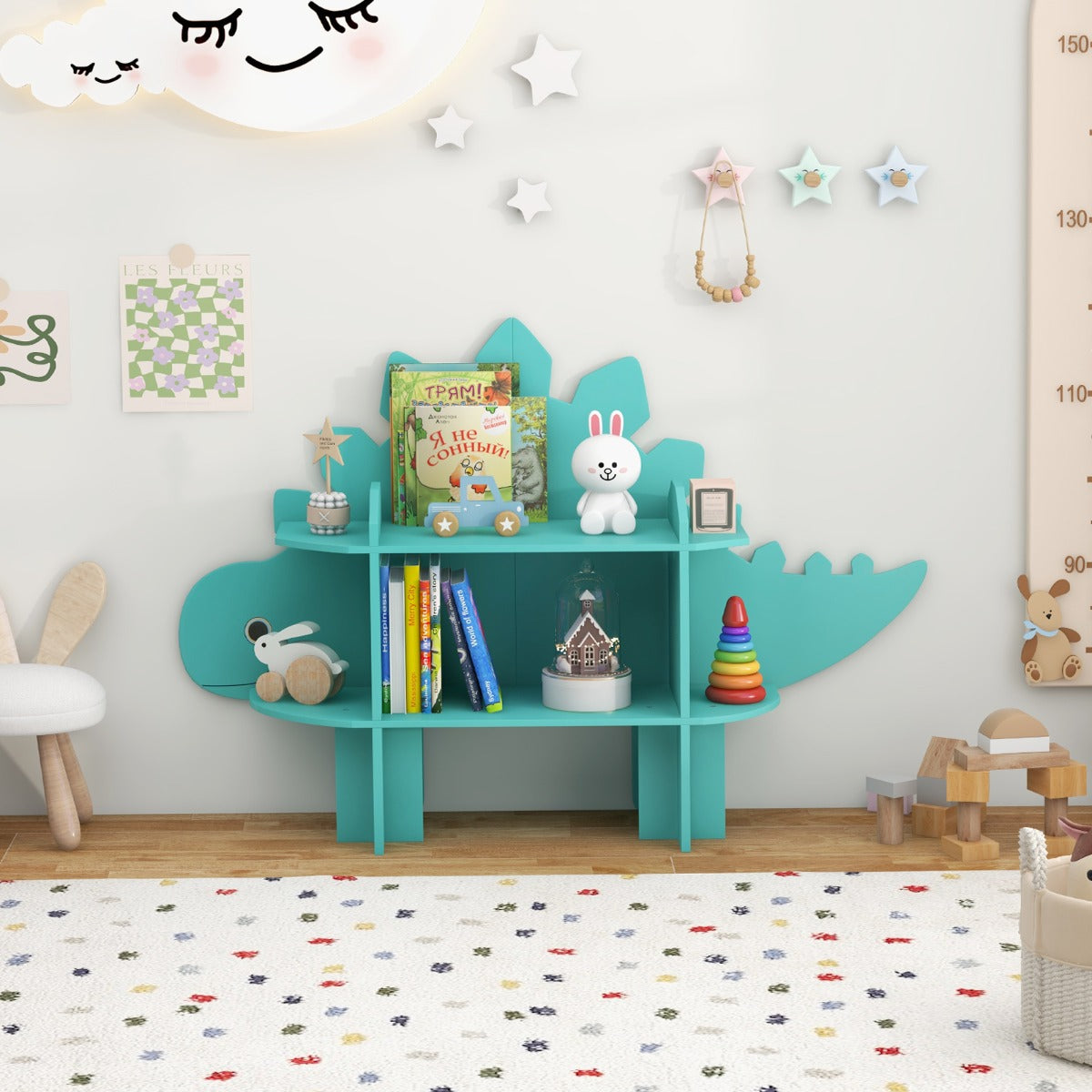The kids storage unit filled with books and toys in a decorated nursery room
