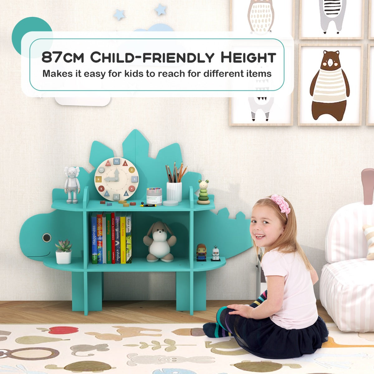 The kids storage unit at a low height with a young girl sitting on the floor nearby