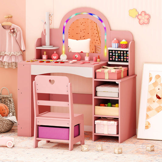 Pink kids vanity desk with mirror and open storage shelves, shown with a chair and some items on top