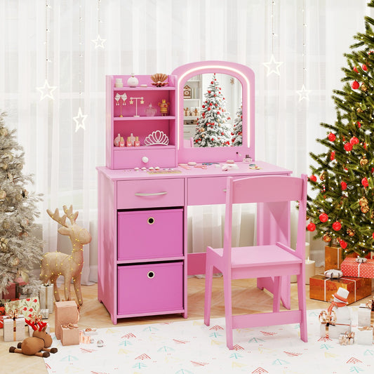 Pink kids vanity set with lighted mirror and storage drawers, displayed in a festive room setting with Christmas tree