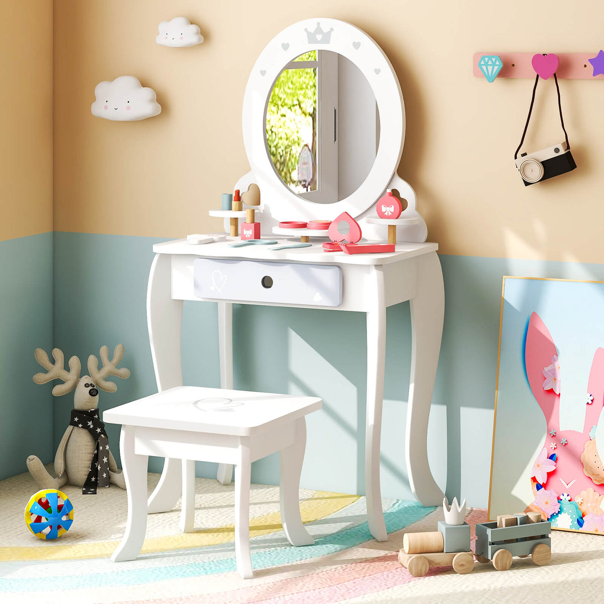 The white dressing table and stool set in a child's bedroom with toys