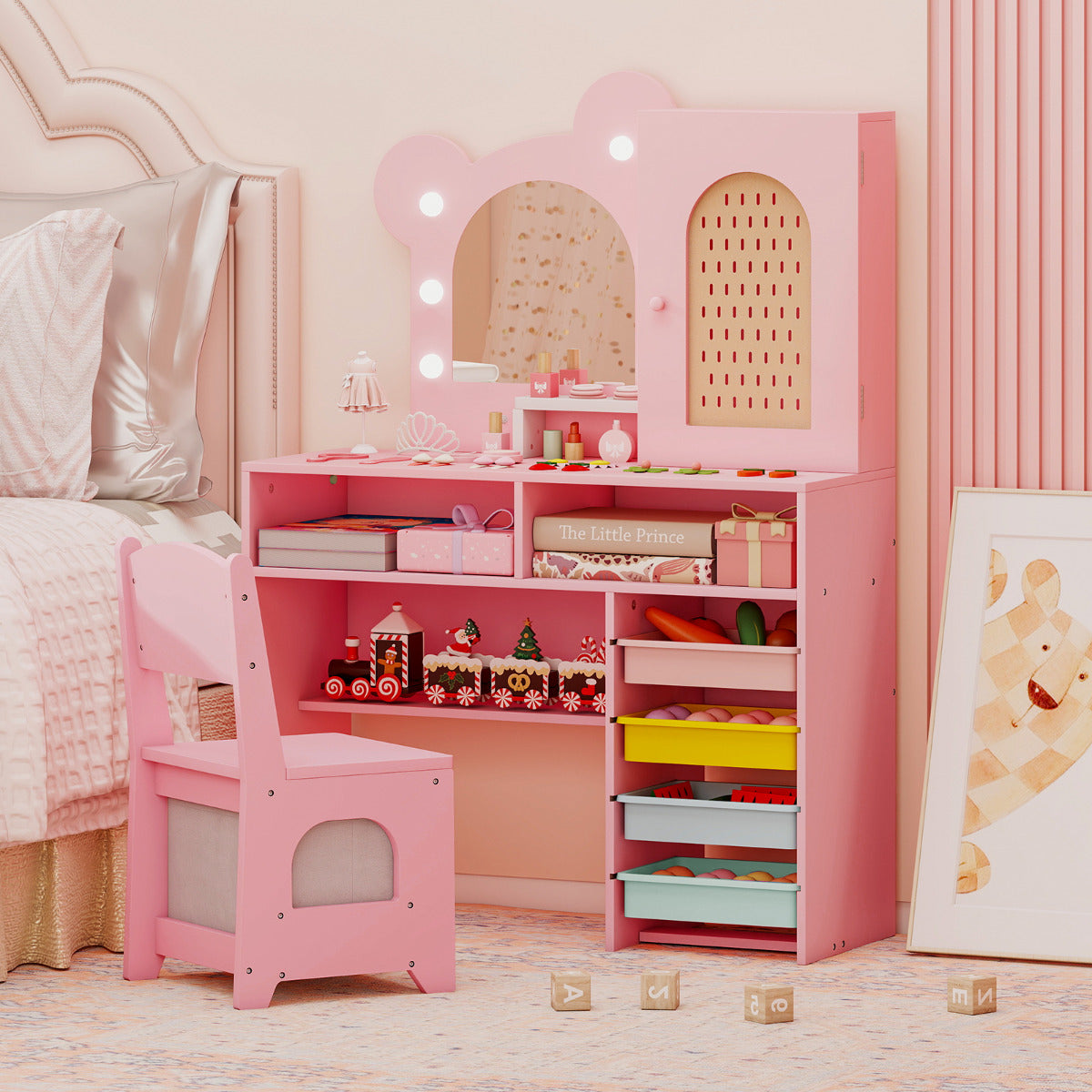 The pink dressing table with lights and chair in a child's bedroom with a bed