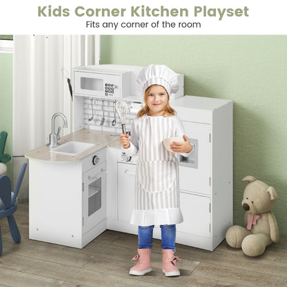 A girl in a chef's outfit stands next to the wooden corner play kitchen in a room