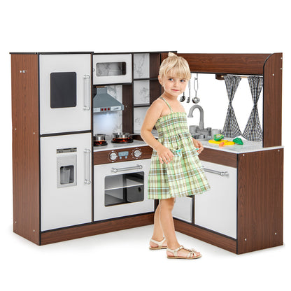 The play kitchen set with a young girl standing beside it to show the scale of the unit