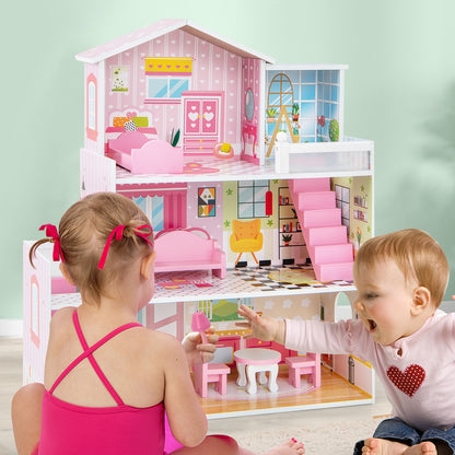 Two toddlers playing with the pink three-story wooden playhouse