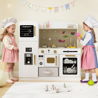 Two children wearing chef hats playing with the white wooden kitchen playset