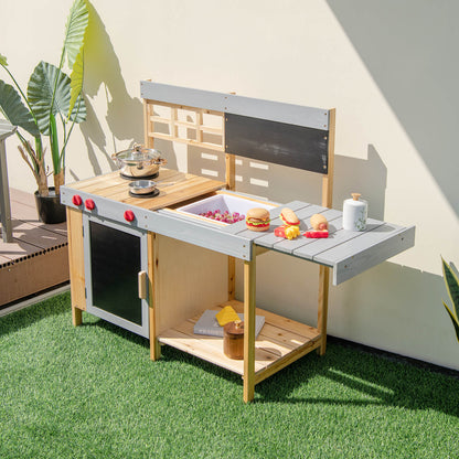 The wooden mud kitchen set with a sink filled with water and play food on the side