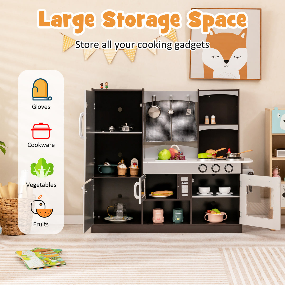 The play kitchen set with all doors open showing the internal storage space and toy accessories